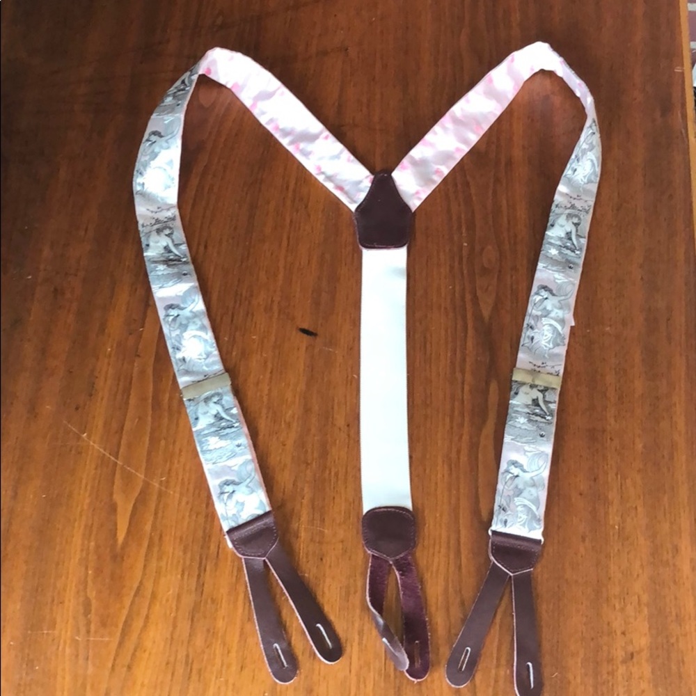 Suspenders with topless women on them.